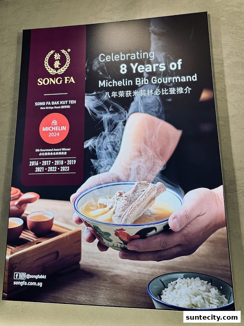 A poster celebrating Song Fa Bak Kut Teh's 8 years of Michelin Bib Gourmand recognition.
