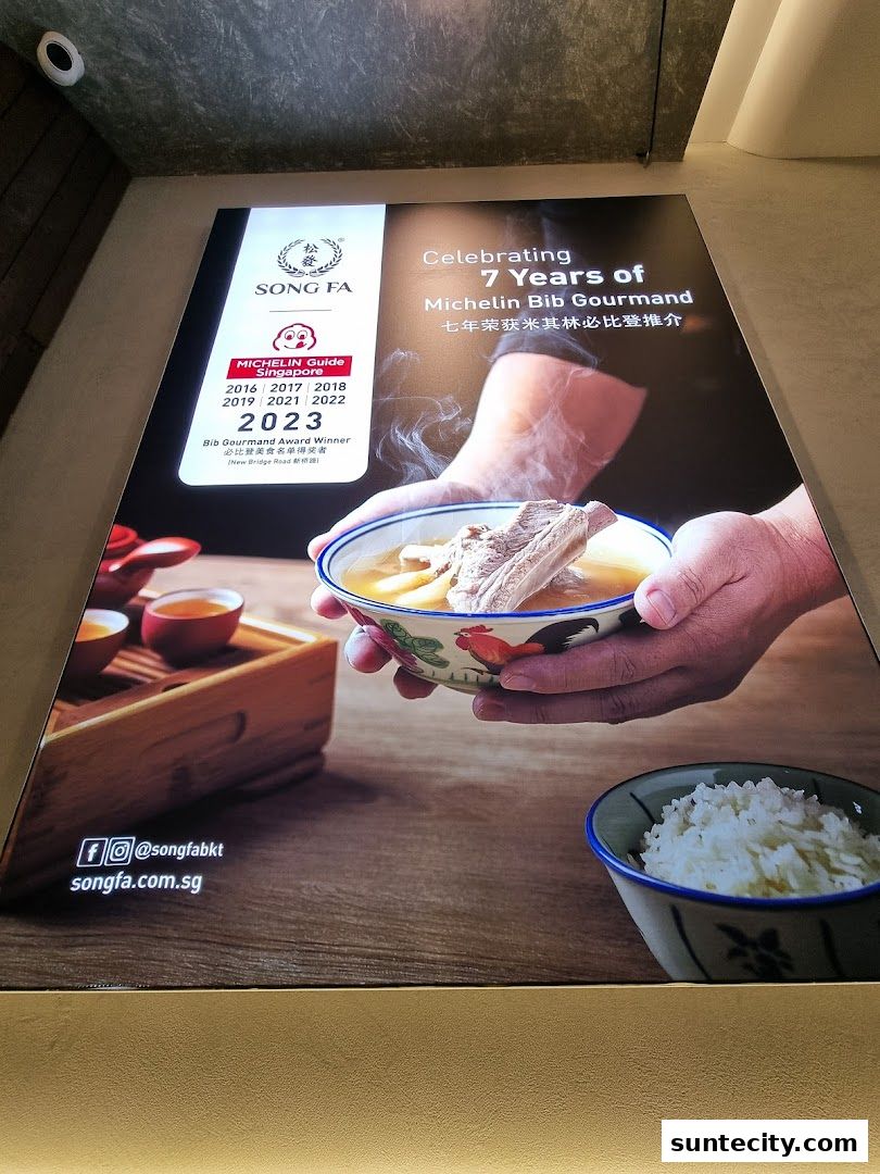 A poster celebrating Song Fa Bak Kut Teh's 7 years of Michelin Bib Gourmand recognition.
