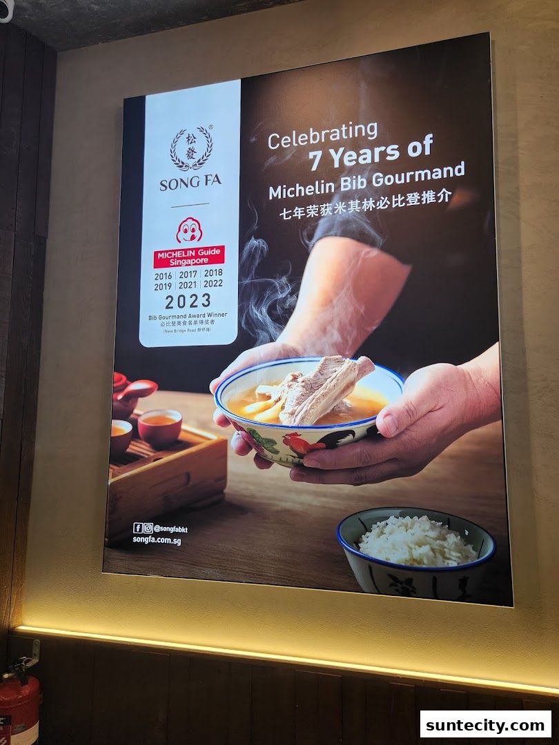 A poster celebrating Song Fa Bak Kut Teh's 7 years of Michelin Bib Gourmand recognition.