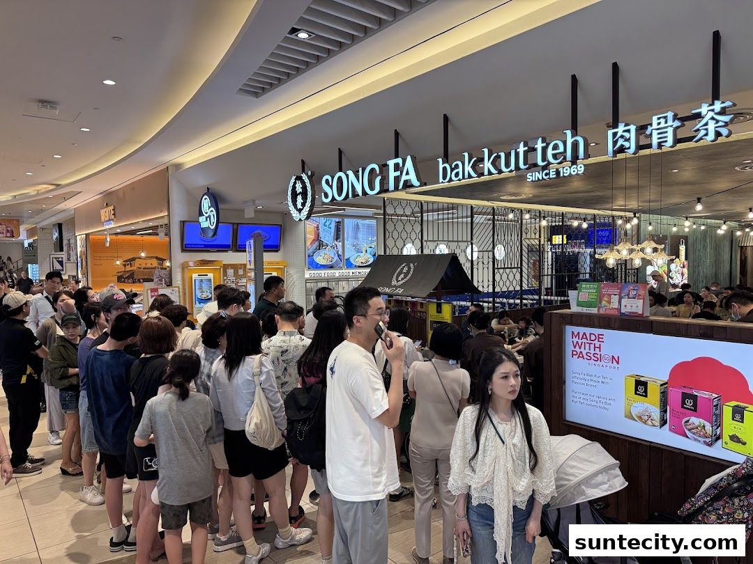 A long queue of people waiting outside Song Fa Bak Kut Teh, a popular restaurant.