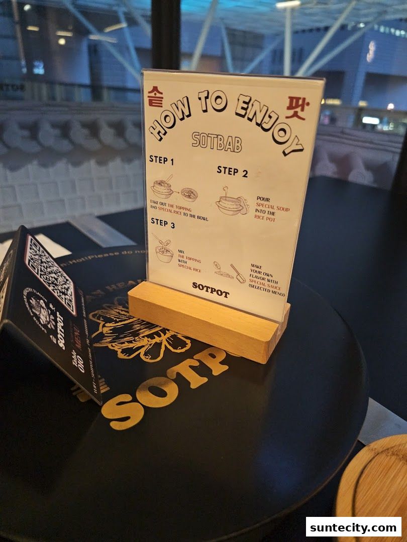 A table at SOTPOT with a sign explaining how to enjoy SOTBAB and a QR code menu.