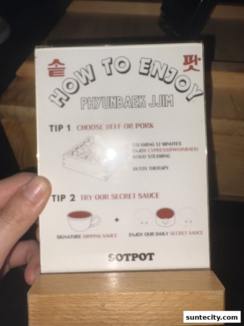 A sign from SOTPOT explains how to enjoy Phyubak Jjim with two tips.