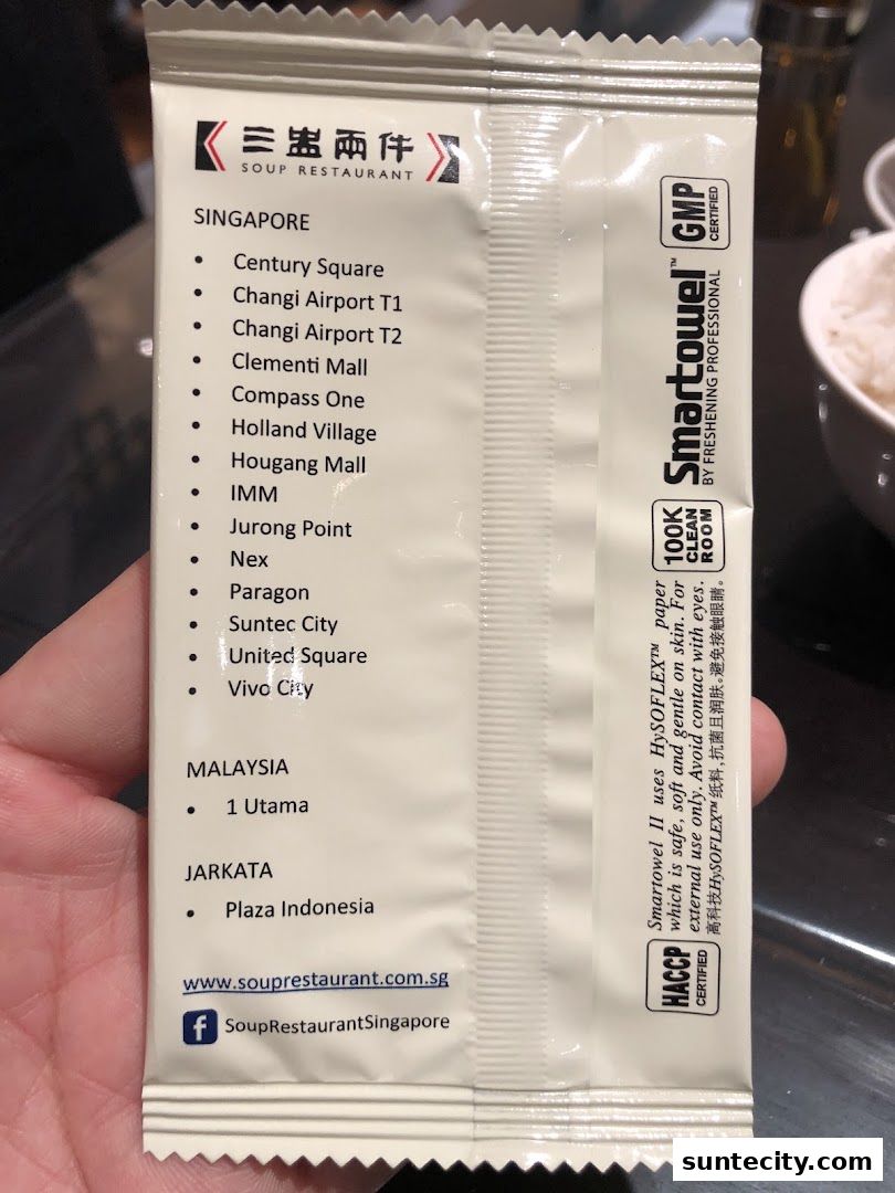 A wet wipe packet from Soup Restaurant listing their Singapore, Malaysia, and Jakarta locations.