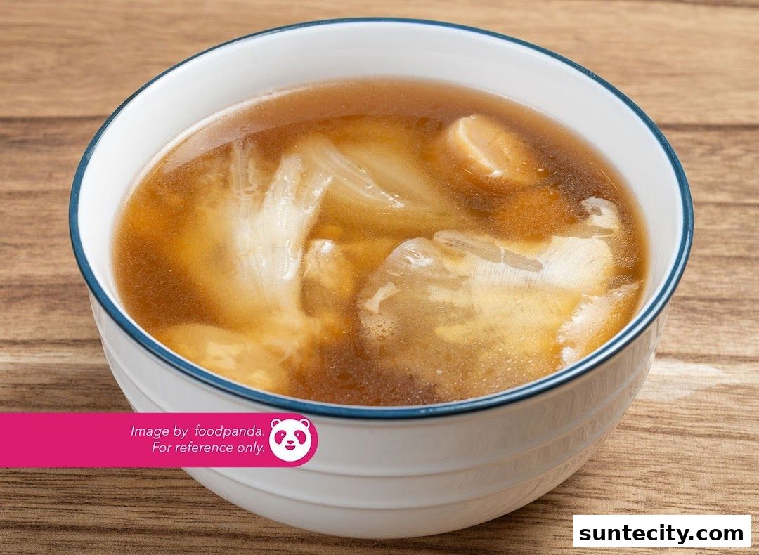 A close-up shot of a bowl of delicious-looking soup with visible ingredients.