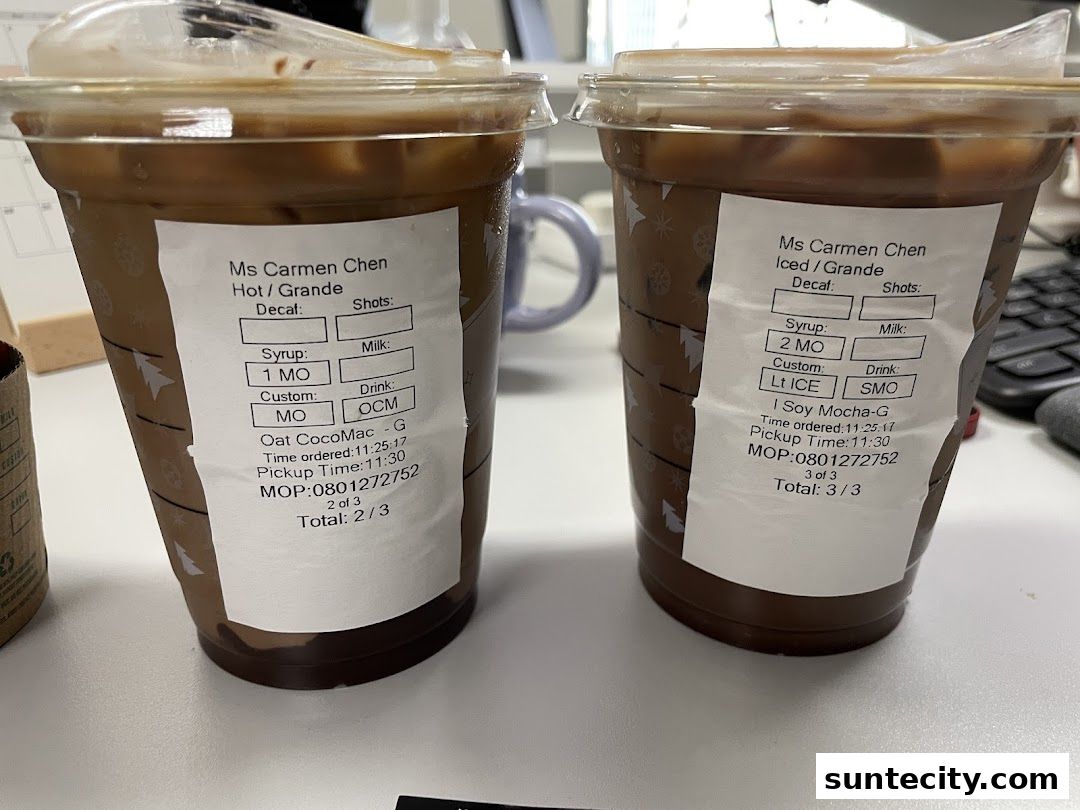 Two Starbucks iced coffee drinks with custom order details on the cups.