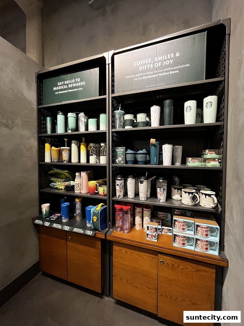 Shelves display a variety of Starbucks merchandise, including tumblers, mugs, and travel accessories.