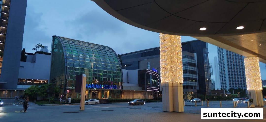 Exterior view of Marina Square shopping mall with illuminated columns and modern architecture.