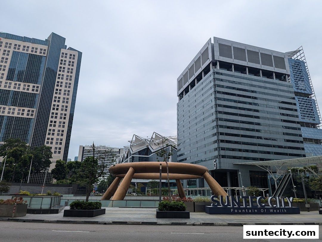 Suntec City landmark with Fountain of Wealth and surrounding modern buildings.
