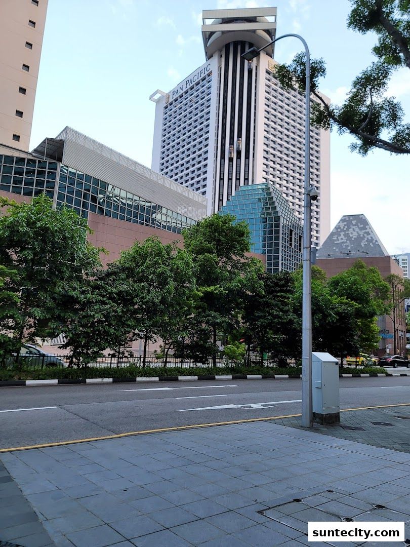 Modern city architecture with Pan Pacific hotel and surrounding buildings.
