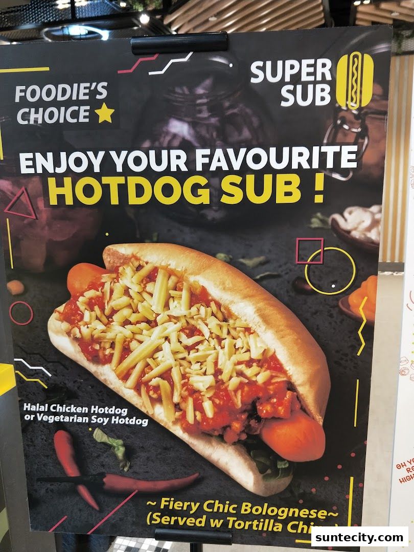 A poster advertising a hotdog sub with Fiery Chic Bolognese and tortilla chips.
