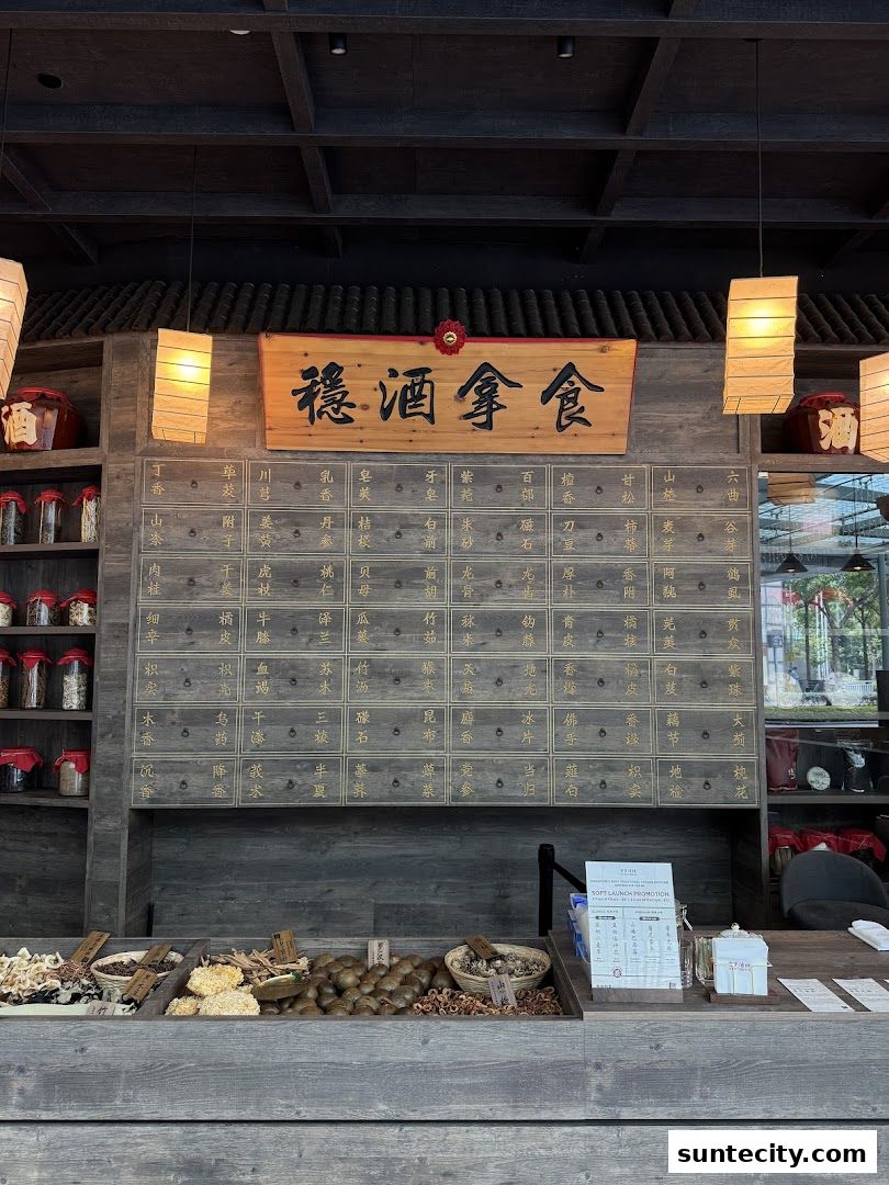 A traditional Chinese medical hall inspired restaurant and cocktail bar interior with wooden drawers and displayed ingredients.