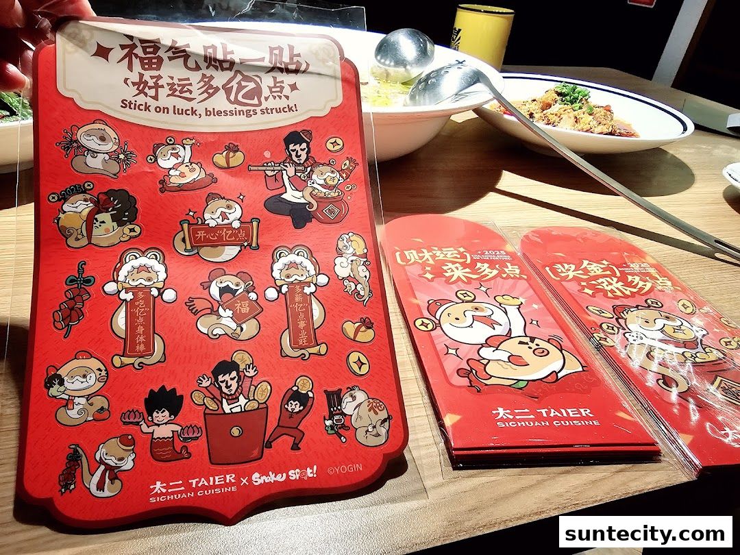 A red sticker sheet and red envelopes with cartoon characters and Chinese text.