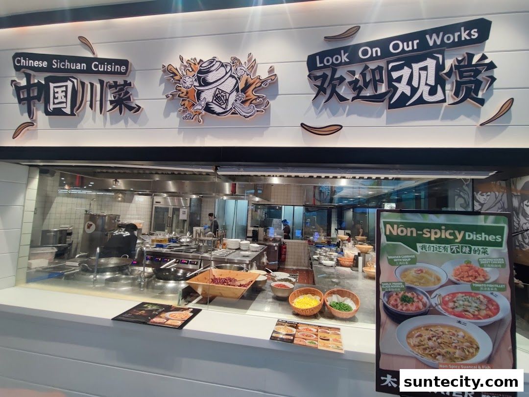 A view of the open kitchen and menu display at Tai Er Suntec, showcasing Sichuan cuisine.
