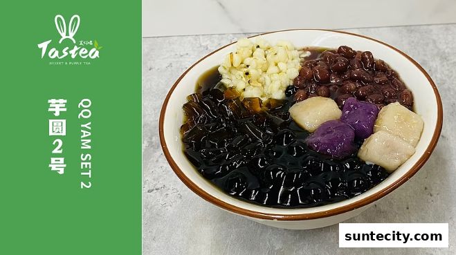 A bowl of QQ Yam Set 2 dessert with various toppings from Tastea.