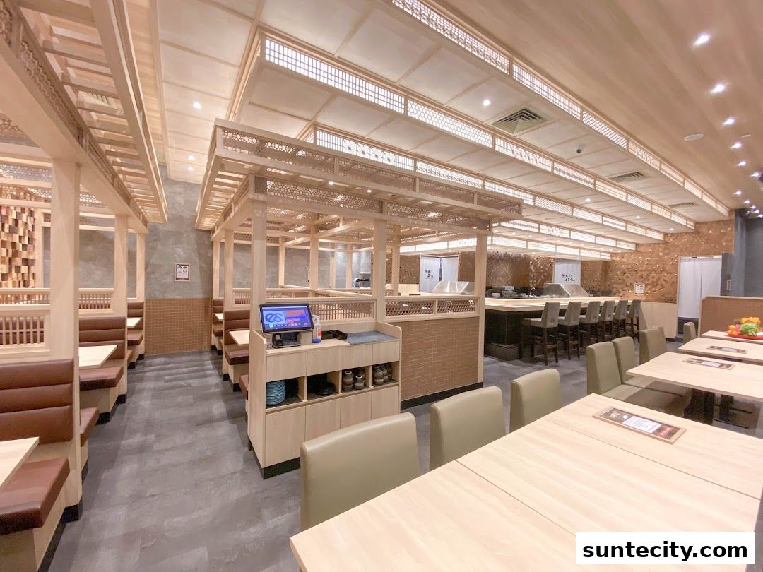 Interior view of Tempura Makino restaurant with private dining booths and a counter seating area.