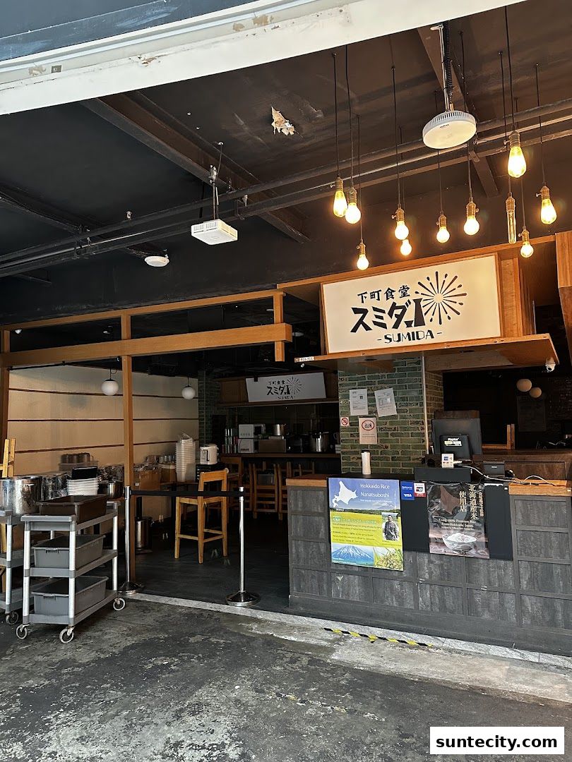 The entrance of Tendon Kohaku, a Japanese restaurant, with its signage and interior visible.