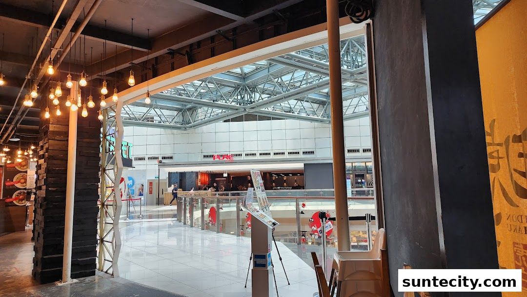 Interior view of a restaurant with decorative lighting and a view of the mall atrium.