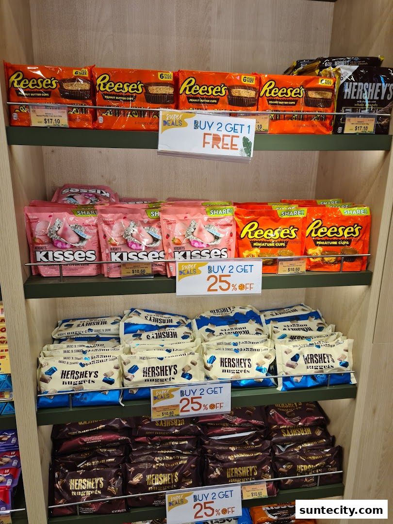 Shelves stocked with various Hershey's and Reese's chocolates, featuring promotional signs.