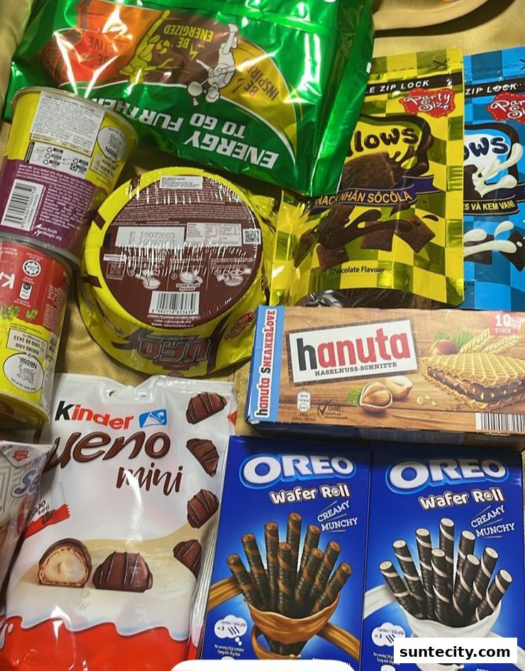 A collection of assorted chocolates, snacks, and wafers from various brands.