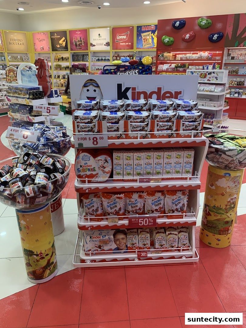 A display of Kinder chocolate products and other confectionery items at The Cocoa Trees.