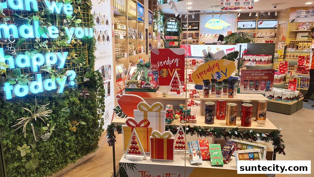 A festive shop display featuring chocolates, gift baskets, and holiday-themed items.