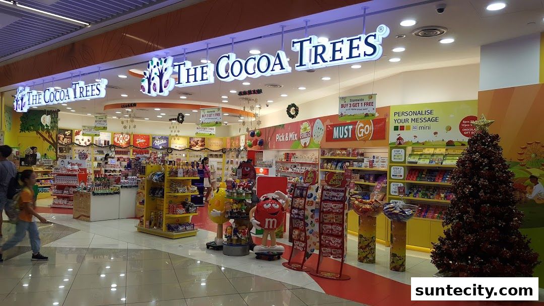 The Cocoa Trees shop front with a wide selection of chocolates and candies, featuring M&M characters and a Christmas tree.