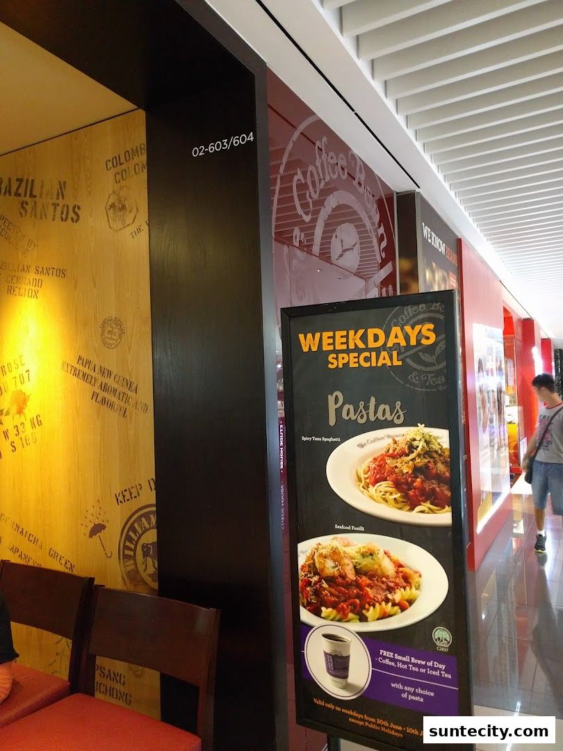 A sign advertising a weekday pasta special at The Coffee Bean & Tea Leaf.
