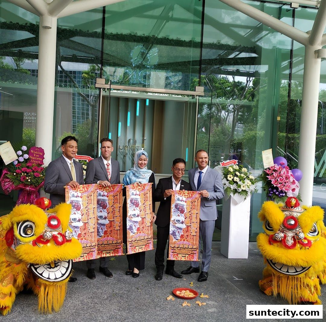 A group of people in formal attire stand outside a building with lion dance figures.