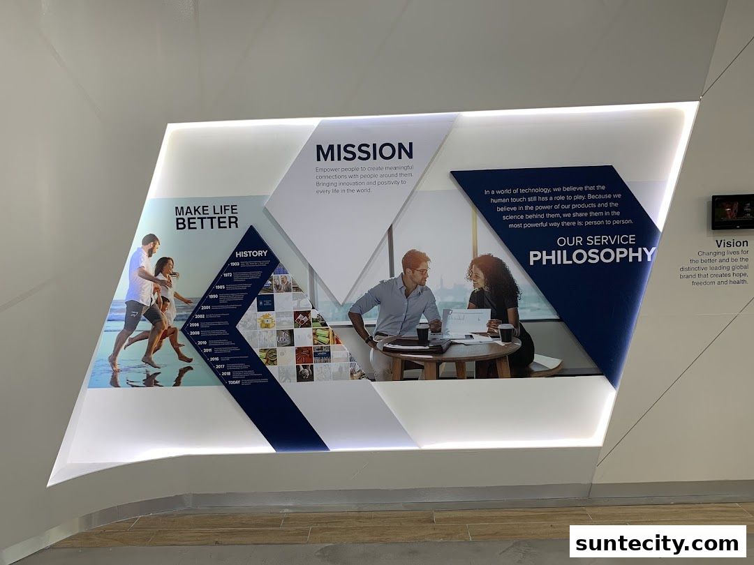 A wall display with company mission, history, and philosophy statements.