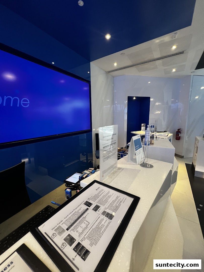 Interior of a UOB bank branch with a large screen and service counter.