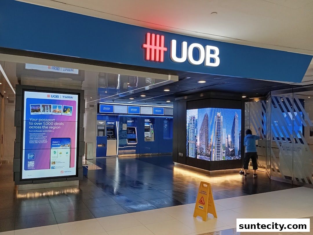 The UOB bank branch entrance with ATMs and digital displays.