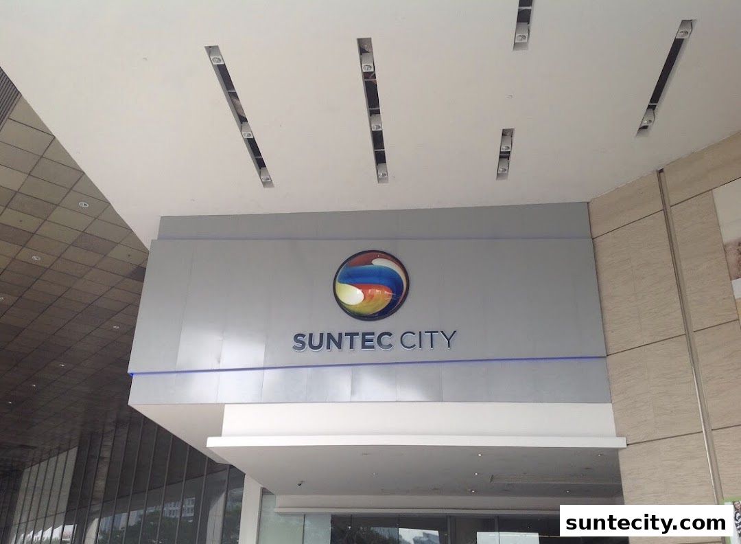The Suntec City logo is displayed prominently on a modern building facade.