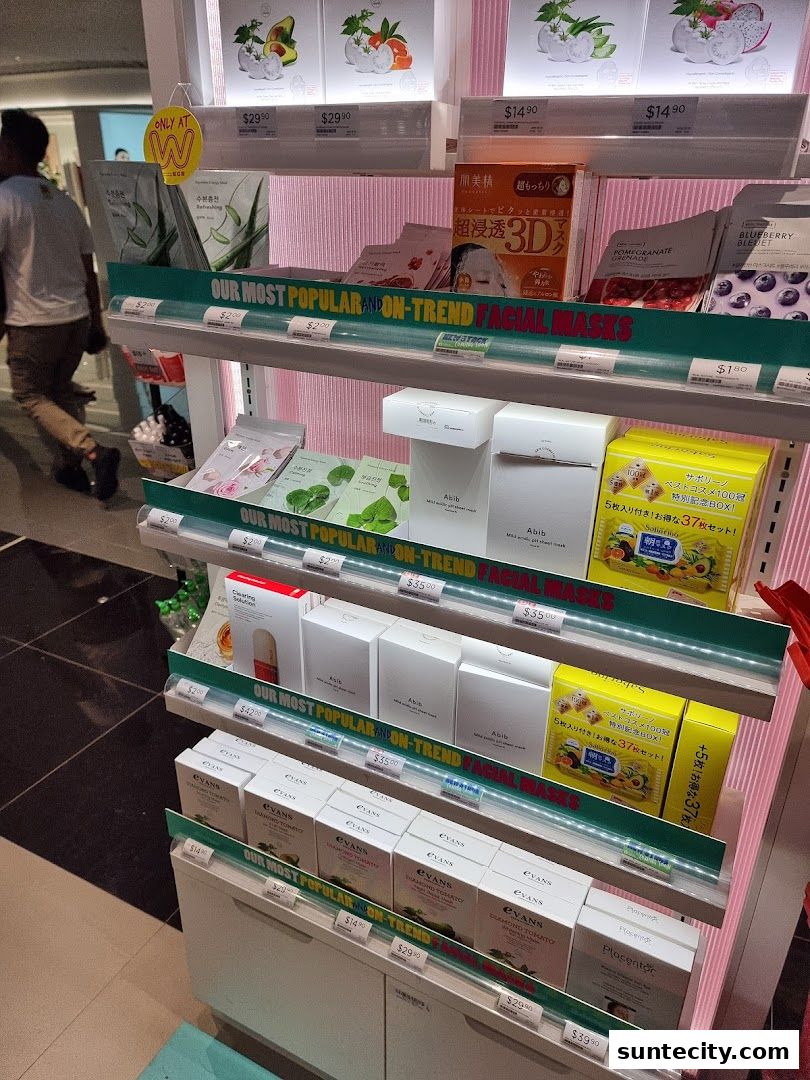 A display of various facial masks and skincare products on shelves in a Watsons store.