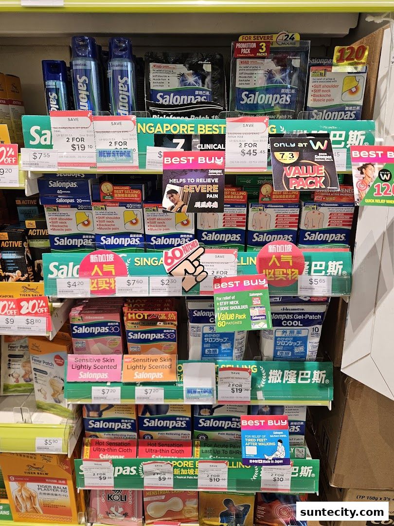 A display of various Salonpas pain relief patches and sprays in a retail store.