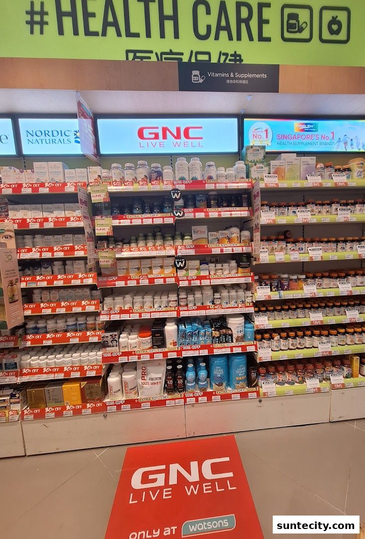 Shelves stocked with various vitamins, supplements, and health products, with GNC branding prominent.