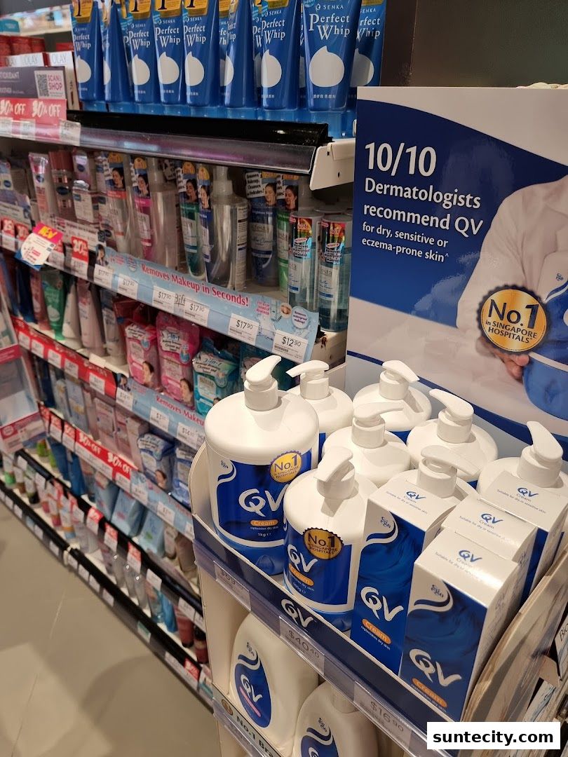 Shelves stocked with skincare products, featuring prominent displays of QV cream and Senka Perfect Whip.