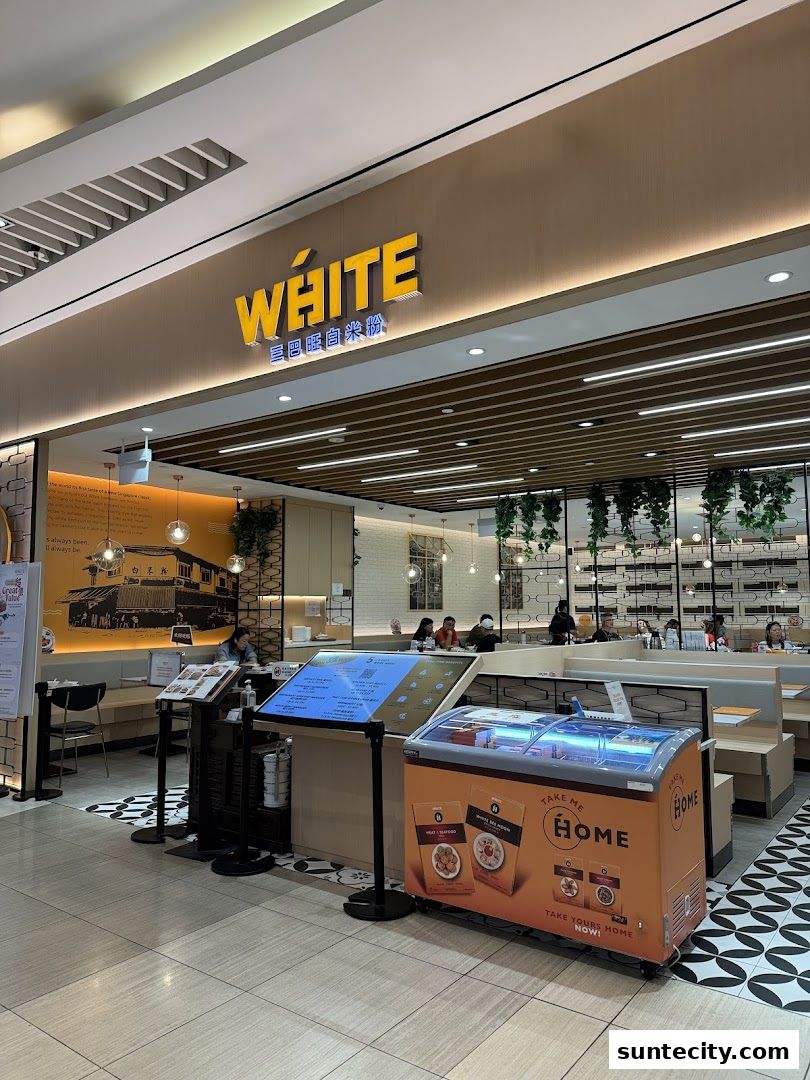 The exterior of the White Restaurant Suntec City, featuring its prominent signage and inviting interior.