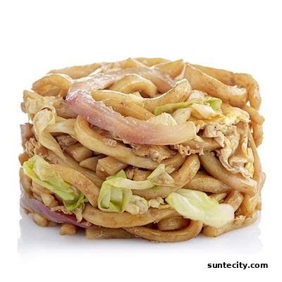 A close-up shot of a delicious stir-fried noodle dish with vegetables and meat.