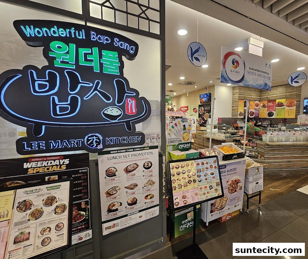 The exterior of a Korean restaurant called Wonderful Bap Sang, featuring its neon sign and promotional menus.