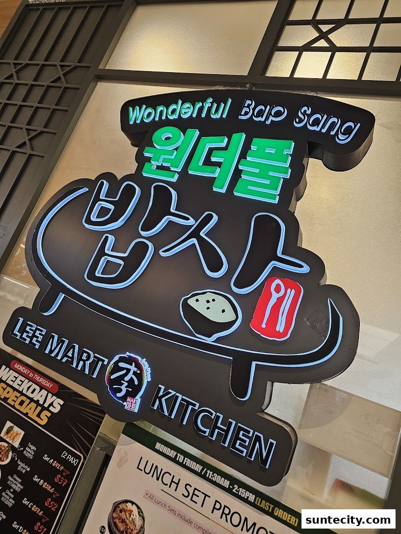 A neon sign for Wonderful Bap Sang, a Korean restaurant, with menu details visible.
