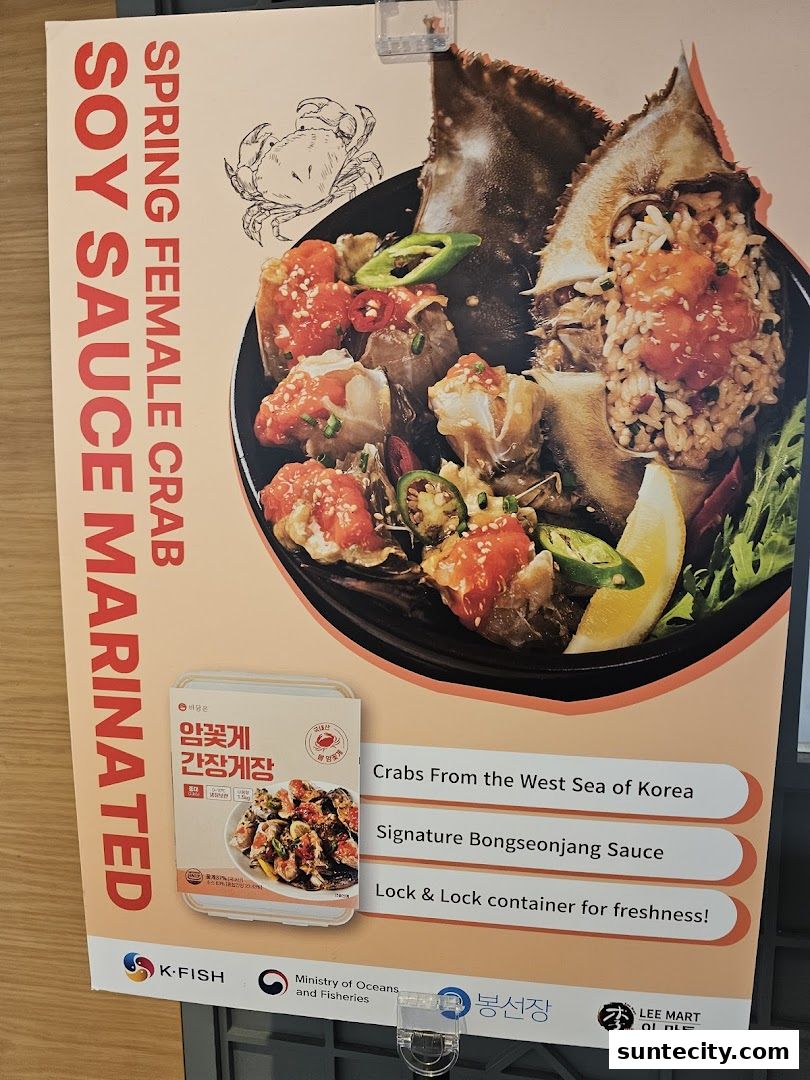 A poster advertising Spring Female Crab marinated in soy sauce, featuring a dish and product packaging.