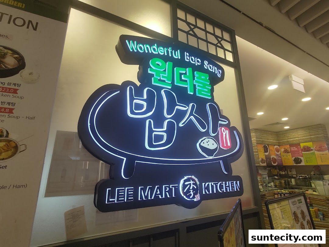 The illuminated sign for Wonderful Bap Sang restaurant, featuring Korean text and the Lee Mart Kitchen branding.