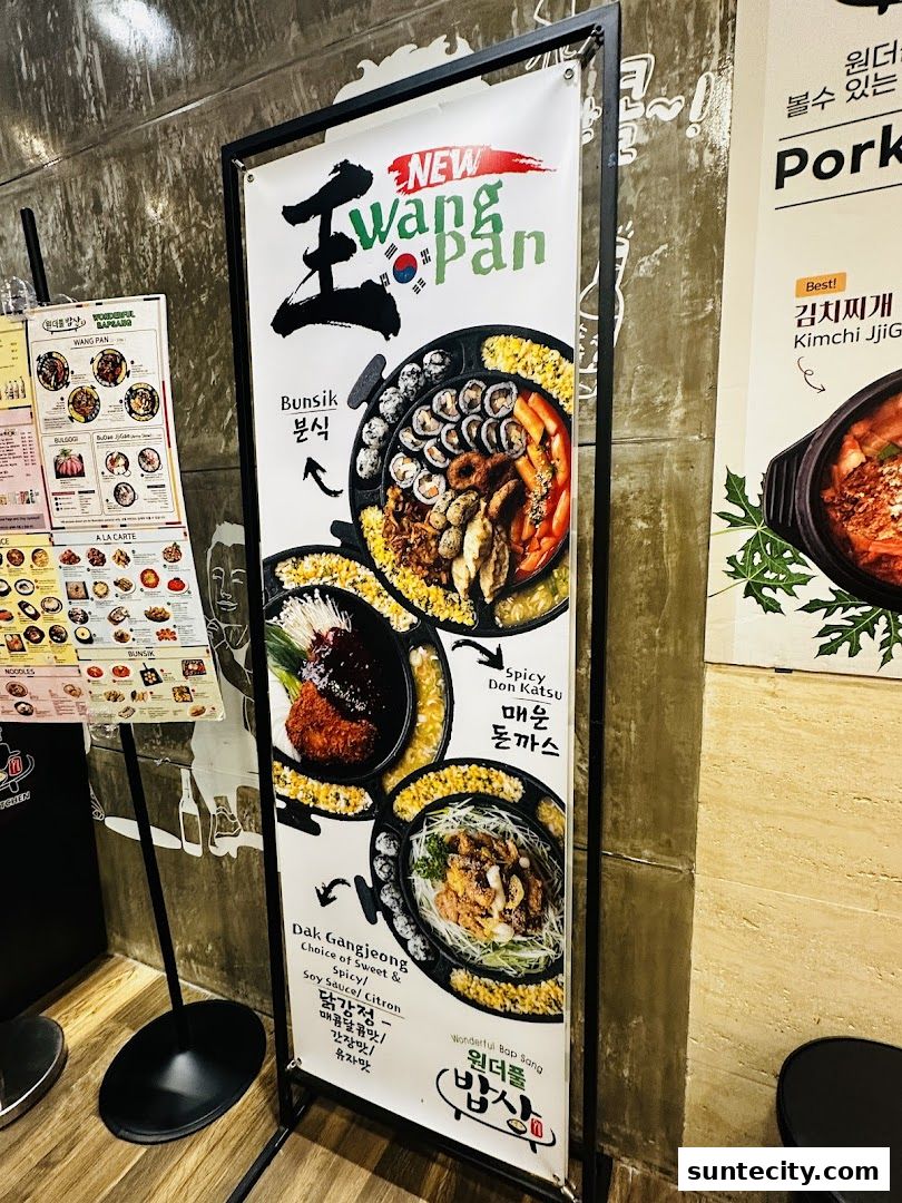 A vertical banner showcasing Korean dishes like Bunsik, Spicy Don Katsu, and Dak Gangjeong.
