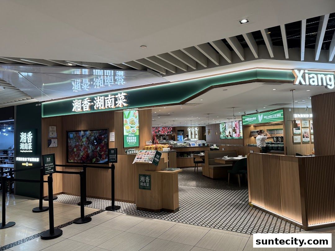 The entrance of Xiang Xiang Hunan Cuisine restaurant with its signage and interior visible.