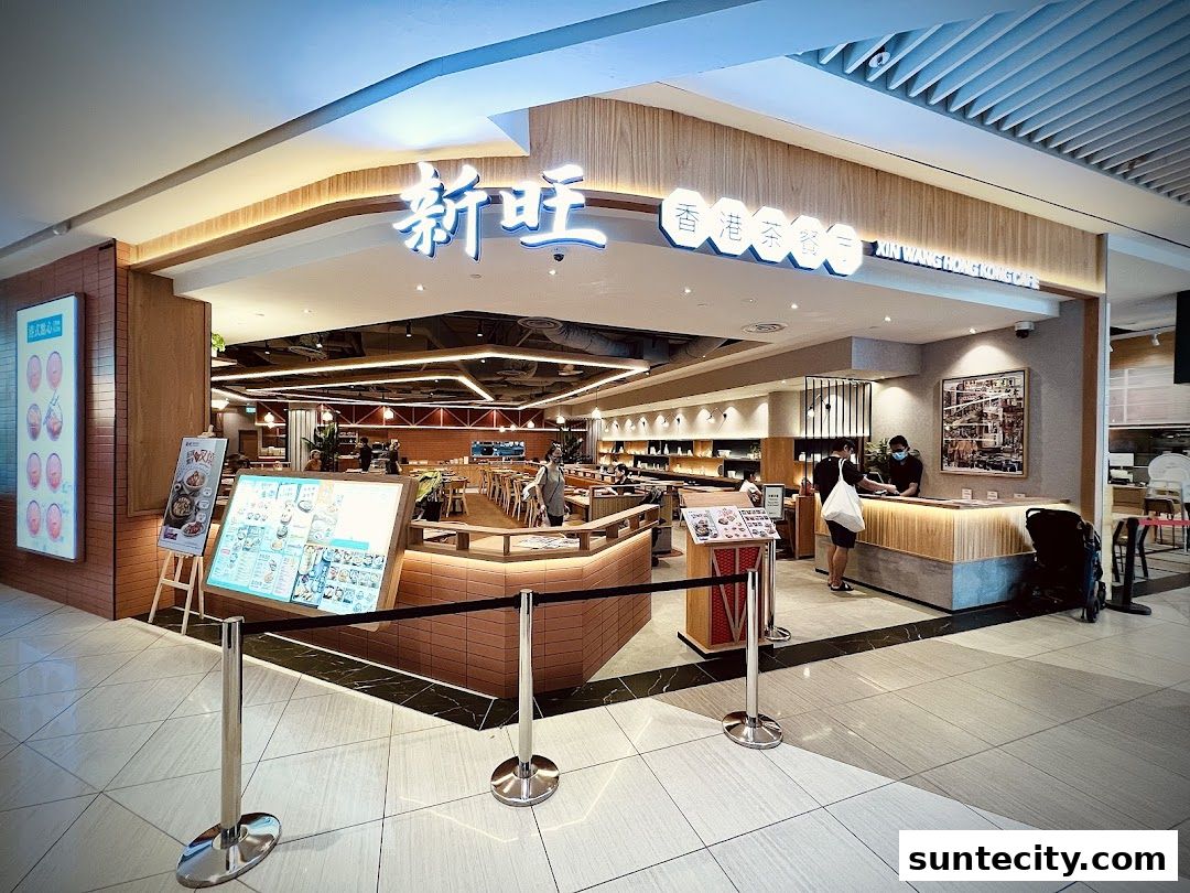 The exterior of Xin Wang Hong Kong Cafe, showcasing its modern interior and signage.