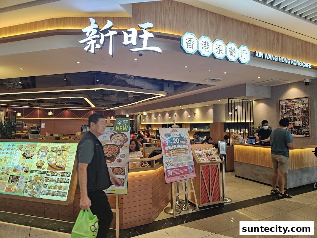 Xin Wang Hong Kong Cafe storefront with a menu display and customers.