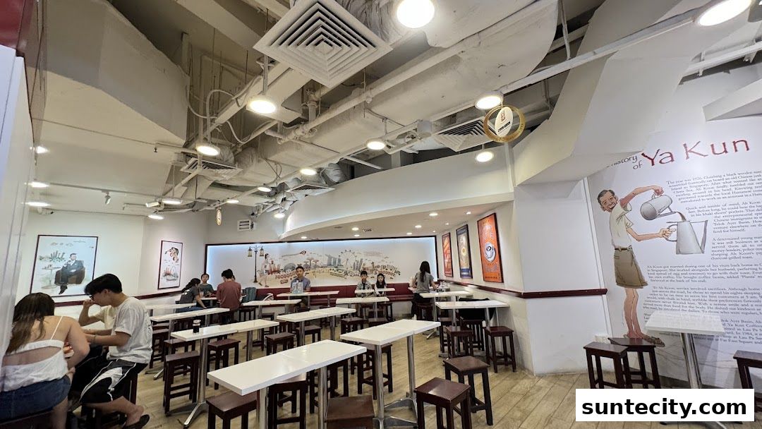 Interior view of Ya Kun Kaya Toast with customers seated at tables.