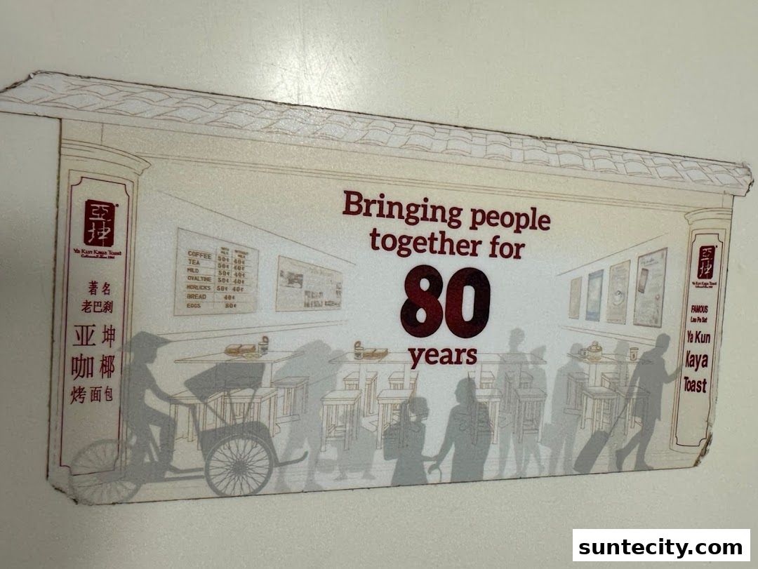 A graphic celebrating 80 years of Ya Kun Kaya Toast, featuring menu items and silhouettes.
