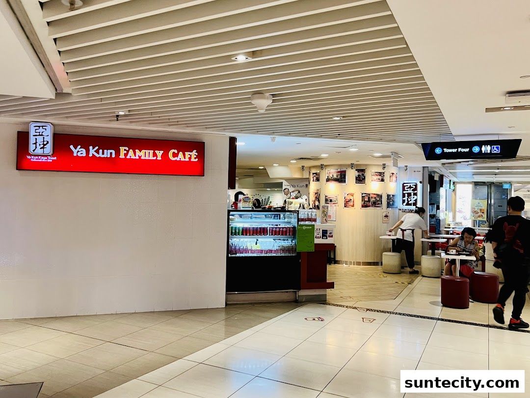 The entrance to Ya Kun Family Cafe with its prominent signage and interior seating visible.