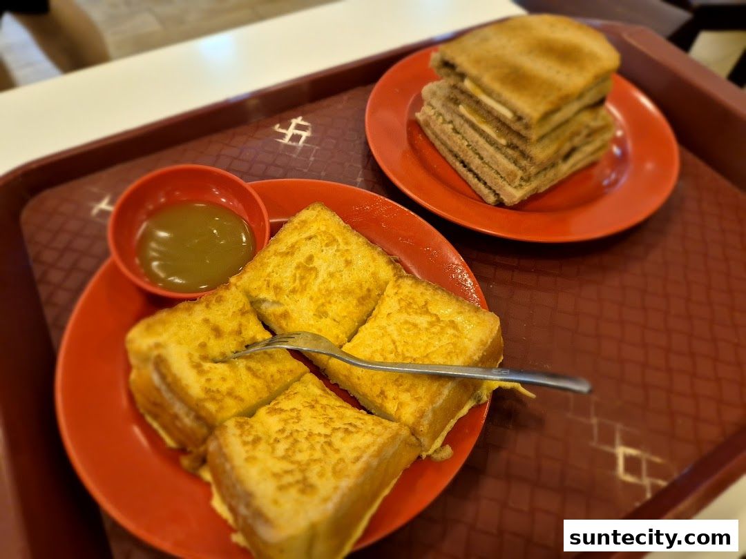 A close-up shot of kaya toast and coffee on a tray at Ya Kun Kaya Toast.